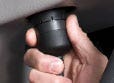 A person holding a black object Description automatically generated with low confidence